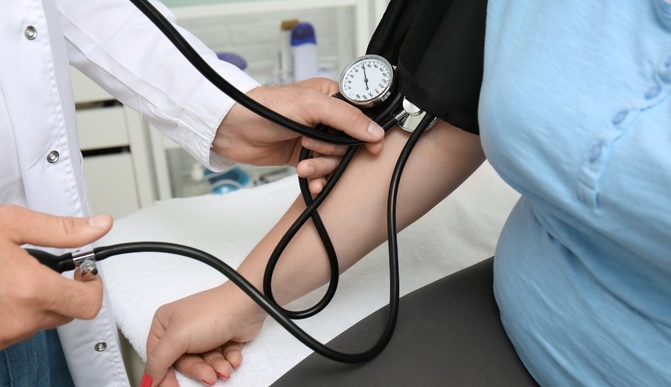 Person gets checked for blood pressure,CO