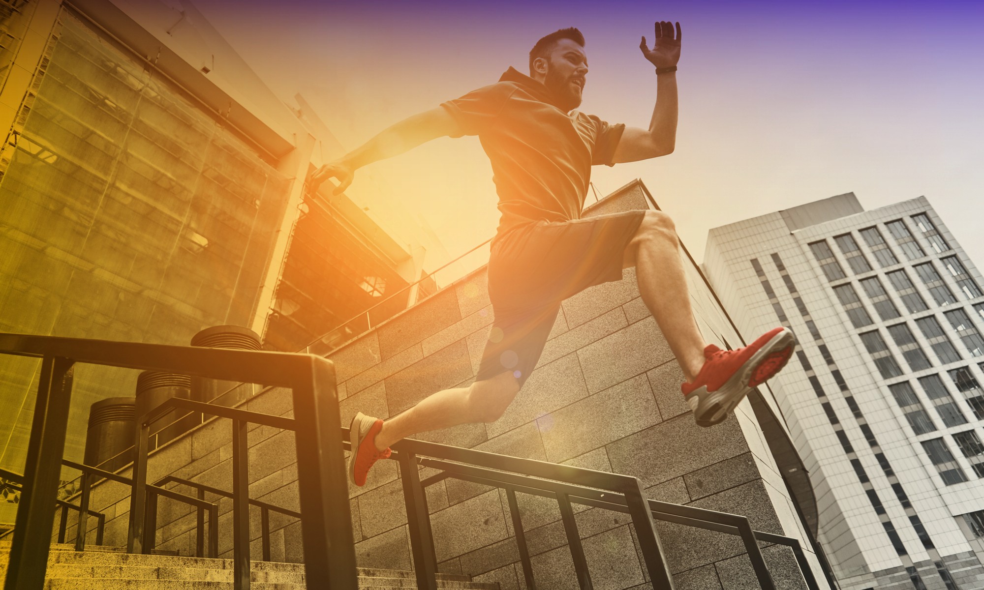 In South Denver, a man energetically jumps on a railing, representing the spirit of Fit, for life