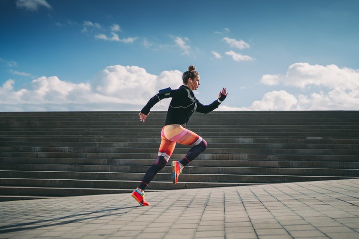 Sportswoman sprinting in the city
