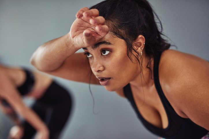 Women relaxing after heavy workout, CO