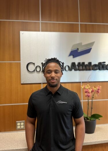 Clayton Smith in athletic wear with fitness equipment in background at Wellbridge