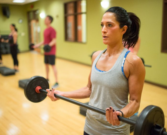 BodyPump class with weight bars at South Denver athletic center