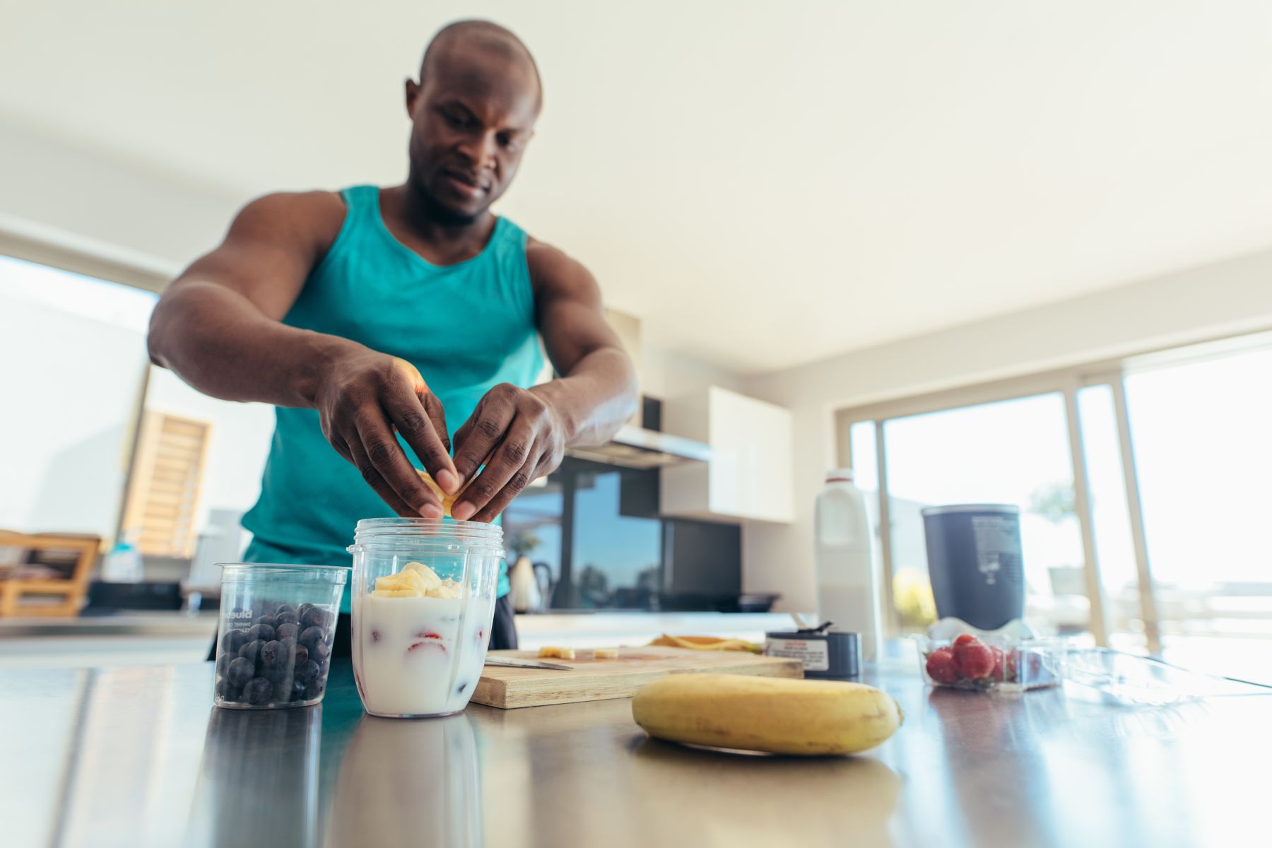 The Man making a pre workout meal in home at Greenwood Village, CO
