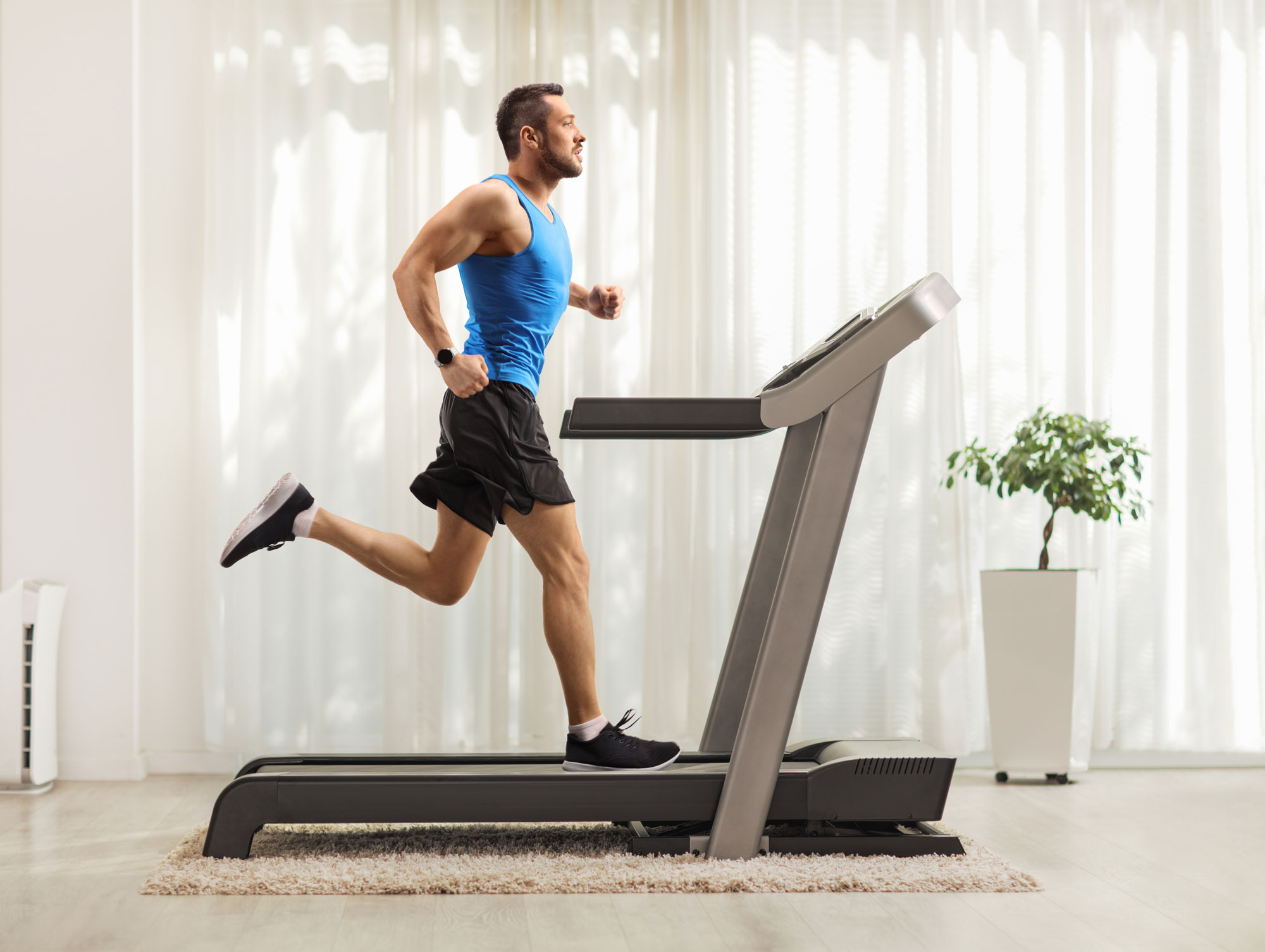 man running on treadmill