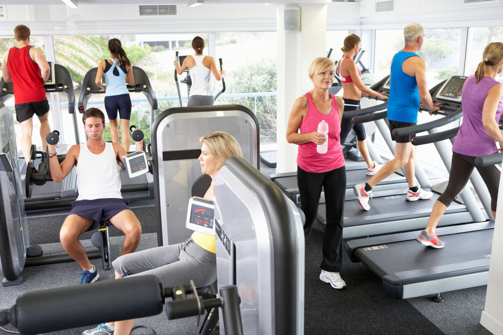 People Exercising in gym.