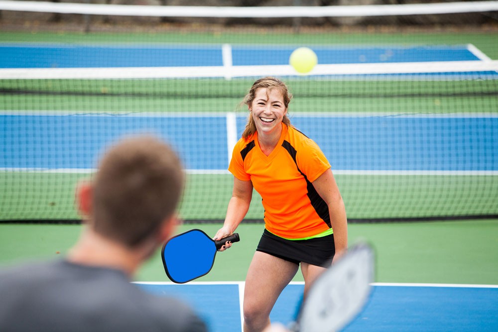 two people playing tennis