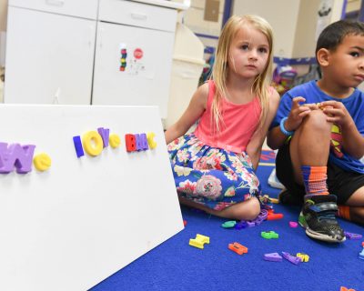 Girl and Boy Playing and Learning | Free Childcare While You Workout at Colorado Athletic Club - Monaco