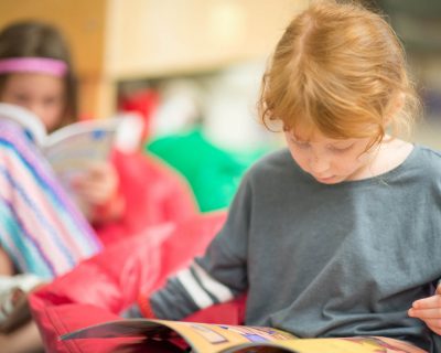 Girls Reading at Colorado Athletic Club - Flatirons Childcare