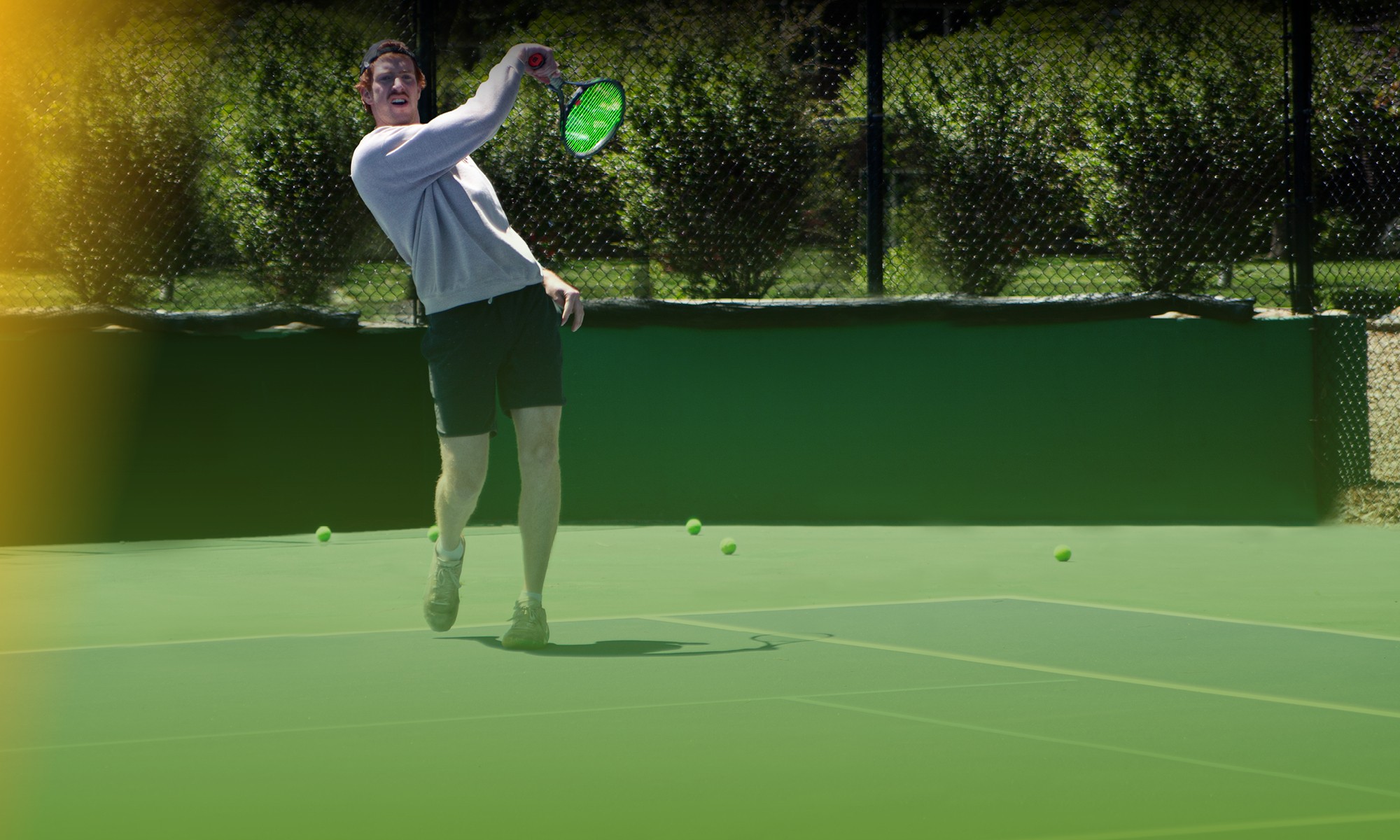 A man is seen playing tennis at the court in Colorado Athletic Club