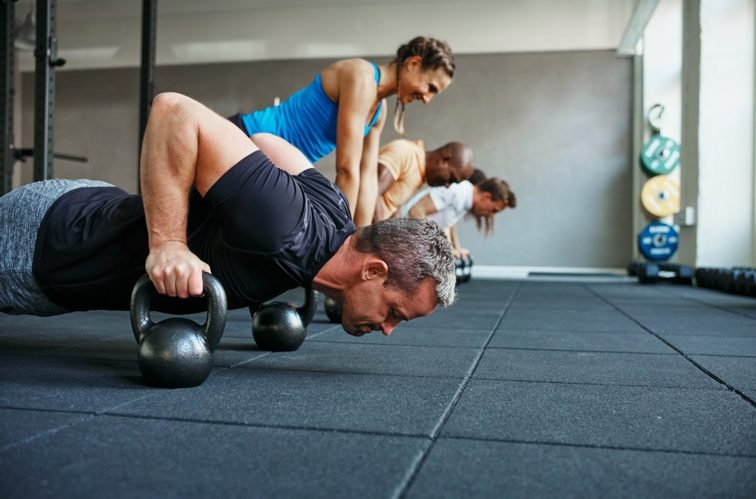 Group Fitness Class Doing Modified Pushups | Colorado Athletic Club - DTC