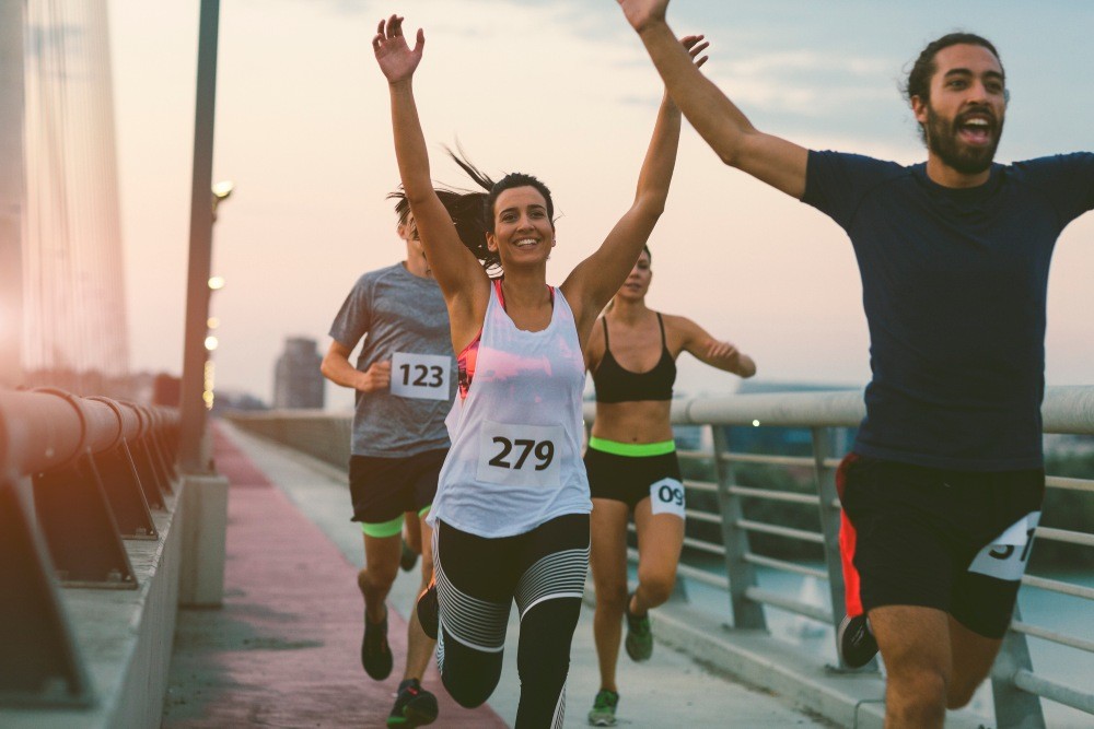 Woman Finishing A Marathon