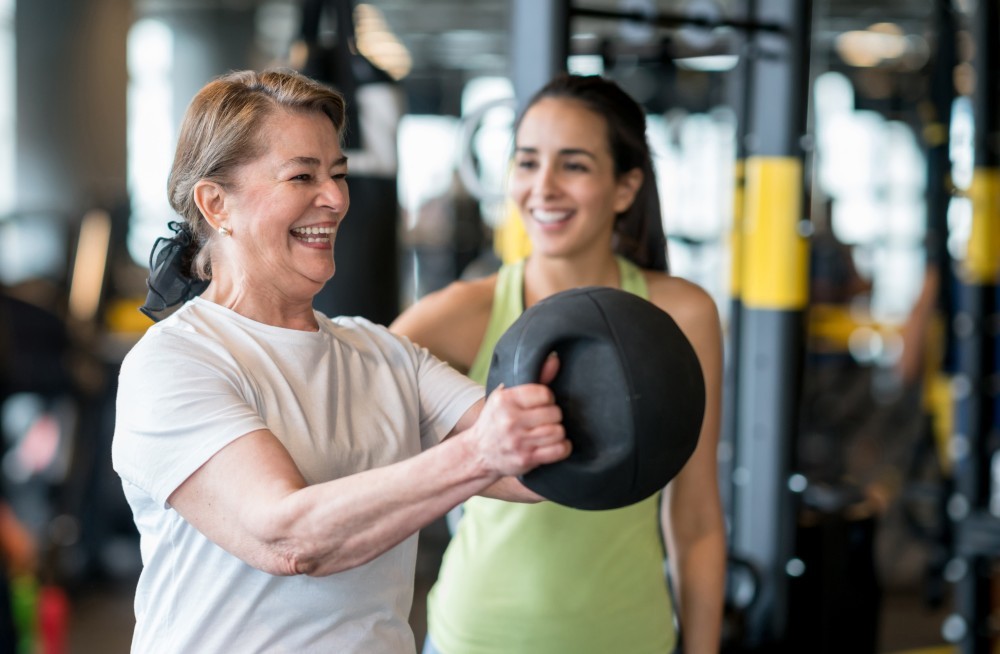 Woman Working With A Personal Trainer